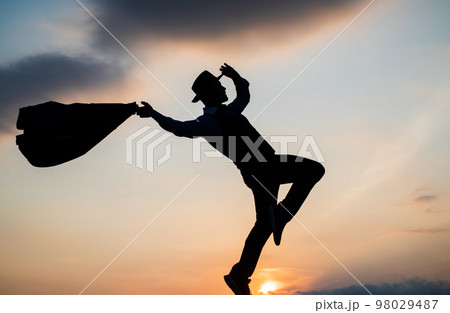 personal achievement goal. man silhouette jump on sky background. confident businessman running. daily motivation. enjoying life and nature. business success. freedom. It is about freedom personal achievement goal. man silhouette jump on sky background. confident businessman running. daily motivation. enjoying life and nature. business success. freedom. It is about freedom 98029487
