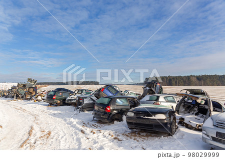 Disassembled cars on a car dump are on sale for spare parts. Disassembled cars on a car dump are on sale for spare parts. 98029999