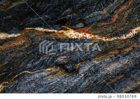 Rocky shapes on the beach. textures and patterns generated on the stones of the Asturian beaches Rocky shapes on the beach. textures and patterns generated on the stones of the Asturian beaches 98030769