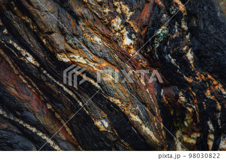 Rocky shapes on the beach. textures and patterns generated on the stones of the Asturian beaches 98030822