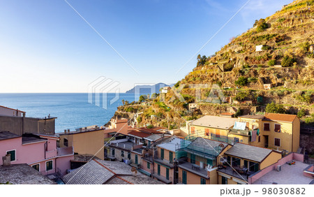 Small touristic town on the coast and farmland, Manarola, Italy. Cinque Terre 98030882