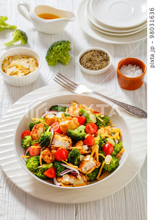 fried chicken tenders broccoli salad in bowl fried chicken tenders broccoli salad in bowl 98031636