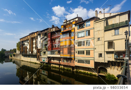 Canal in middle of buildings in Castres, France Canal in middle of buildings in Castres, France 98033654