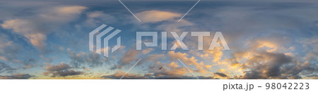 Dark blue sunset sky panorama with golden Cumulus clouds. Seamless hdr 360 panorama in spherical equirectangular format. Full zenith for 3D visualization, sky replacement for aerial drone panoramas. 98042223