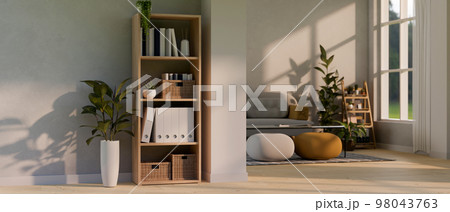 Contemporary and comfortable home living room with shelf, houseplants, sofa, poufs, coffee table Contemporary and comfortable home living room with shelf, houseplants, sofa, poufs, coffee table 98043763