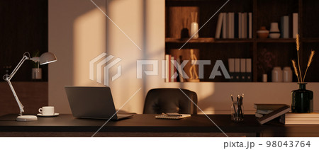 Modern private office room interior with laptop, table lamp, stationery and office supplies on table Modern private office room interior with laptop, table lamp, stationery and office supplies on table 98043764