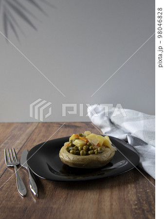 Delicious artichokes on black plate 98046828