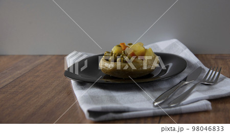 Delicious artichokes on black plate Delicious artichokes on black plate 98046833