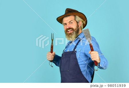happy hipster hold cooking utensils for barbecue. bearded man chef. Tools for roasting meat outdoors. Picnic and barbecue. ready for barbecue party. Culinary concept. summer weekend. copy space happy hipster hold cooking utensils for barbecue. bearded man chef. Tools for roasting meat outdoors. Picnic and barbecue. ready for barbecue party. Culinary concept. summer weekend. copy space 98051939