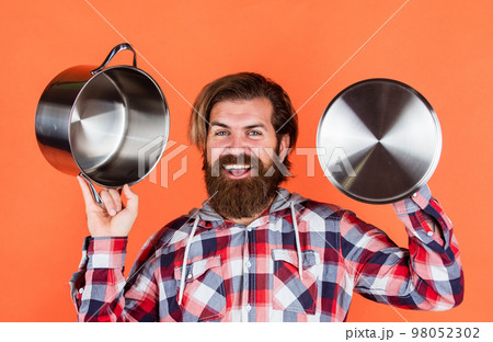 eating healthy. non-stick surface. chef cooking dinner. mature guy in checkered shirt with pan. stylish male going to cook food. bearded man with moustache use kitchen utensils. An amazing experience 98052302