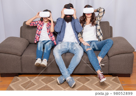mom dad and daughter. digital future and innovation. modern life. father mother and child mom dad and daughter. digital future and innovation. modern life. father mother and child 98052899
