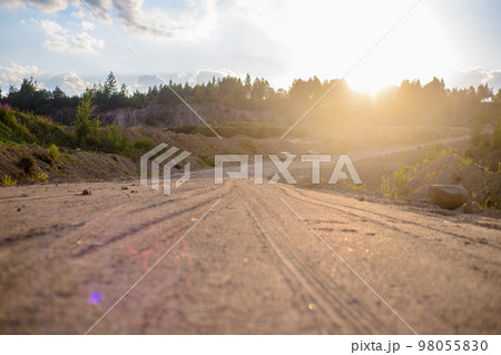 a long road of rubble along the quarry and forest 98055830