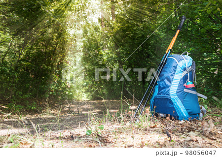 backpack and trekking poles backpack and trekking poles 98056047