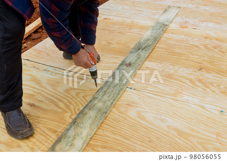 Wood framing beams stick framework of building shed deck foundation Wood framing beams stick framework of building shed deck foundation 98056055