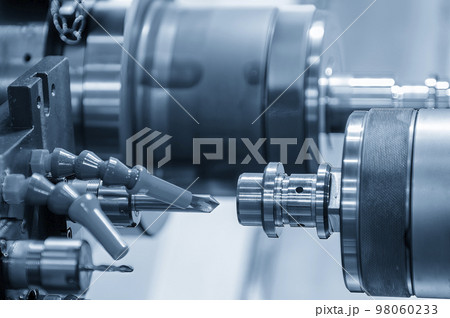 The multi-tasking CNC lathe machine  chamfer cutting the metal shaft parts by milling turret. 98060233