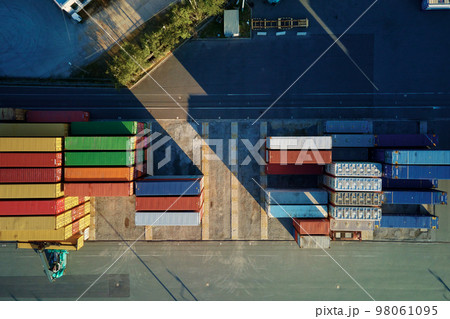 Shipping container site in warehouse storage factory, aerial view. Business and logistic concept, cargo transit 98061095