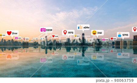 Social media icons fly over city downtown showing people reciprocity connection 98063759