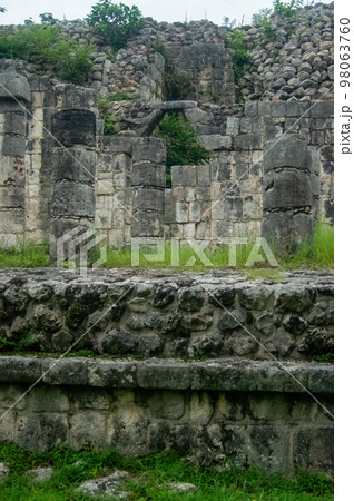mayan pyramids in mexico, stone construction, surrounded by vegetation, deep jungle 98063760