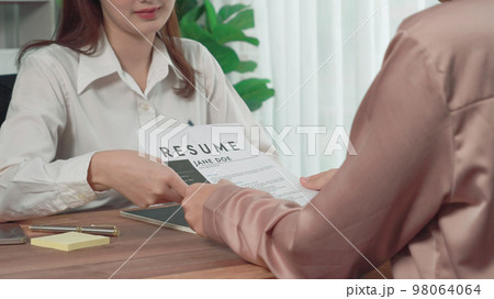 Closeup young and enthusiastic candidate interview with HR manager in office. 98064064