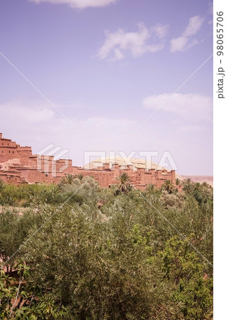 House in tinghir, traditional house of clay and straw. Earth house with blue steel doors. One door open. 98065706