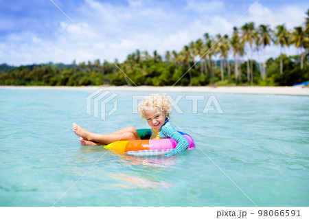 Child on tropical beach. Sea vacation with kids. Child on tropical beach. Sea vacation with kids. 98066591
