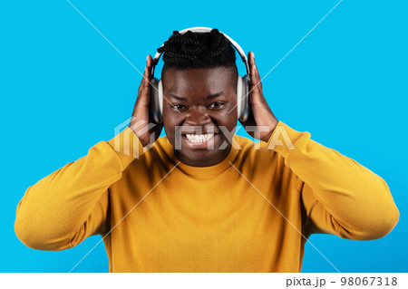 Happy Young African American Man Listening Music In Wireless Headphones 98067318