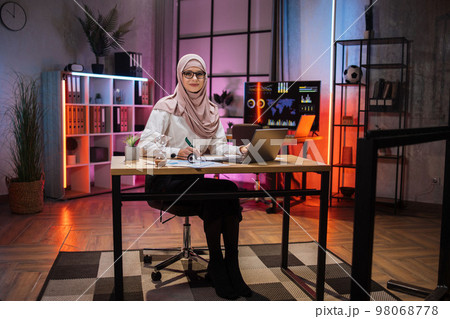 Portrait of attractive confident muslim woman IT specialist, office manager, wearing hijab 98068778