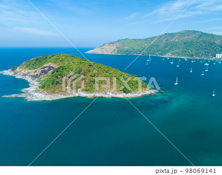 Drone aerial view shot of Tropical sea with beautiful small island in Phuket Thailand 98069141