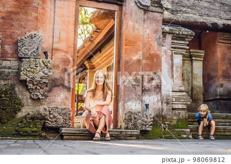 Young woman traveler in Ubud palace, Bali - Inside the Ubud palace, Bali, Indonesia Young woman traveler in Ubud palace, Bali - Inside the Ubud palace, Bali, Indonesia 98069812