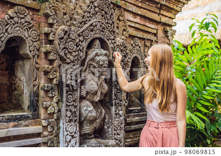 Young woman traveler in Ubud palace, Bali - Inside the Ubud palace, Bali, Indonesia Young woman traveler in Ubud palace, Bali - Inside the Ubud palace, Bali, Indonesia 98069815