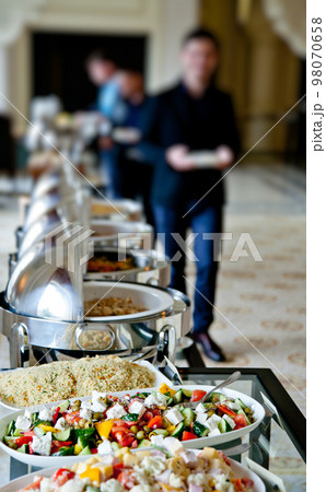 buffet table with salads 98070658