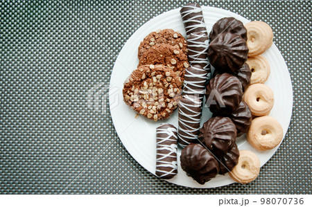 Cookies on a plate. 98070736