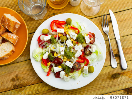 Salad with fresh vegetables, cheese and pesto Salad with fresh vegetables, cheese and pesto 98071871