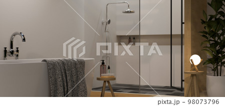 Modern contemporary bathroom interior design with luxury bathtub, towel, shower zone 98073796