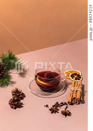 Christmas drink Vin Chaud, French mulled wine ingredients_cinnamon and dried fruits Christmas drink Vin Chaud, French mulled wine ingredients_cinnamon and dried fruits 98074214