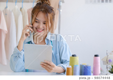 Fashion designer working in studio 98074448