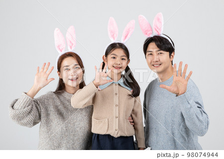 happy Asian Korean family, isolated in white background_wearing rabbit hairband 98074944