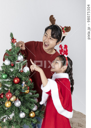 happy Asian Korean family in Christmas concept_decorating the christmas tree 98075304