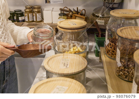 eco friendly habits hand gesture_refill pasta noodles 98076079