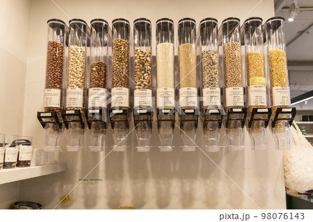 eco friendly habits hand gesture_nuts refill in zero waste shop 98076143