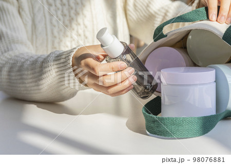 eco friendly habits hand gesture_empty bottle in the eco bag 98076881