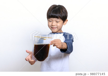 Asian Korean child holding oriental medicine Asian Korean child holding oriental medicine 98077145