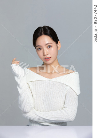 beautiful young Korean Asian woman portrait studio photo in winter skin beauty and cosmetics concept__smiling with hand motion beautiful young Korean Asian woman portrait studio photo in winter skin beauty and cosmetics concept__smiling with hand motion 98077442