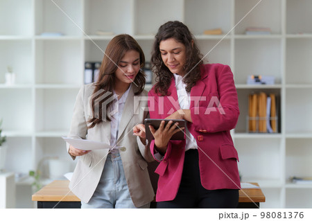 Business People Meeting to discuss and brainstorming the financial report paperwork in home office. Financial advisor teamwork and accounting concept 98081376