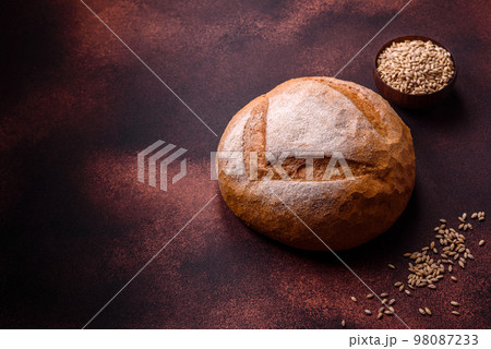 Beautiful delicious freshly baked round shaped white bread Beautiful delicious freshly baked round shaped white bread 98087233