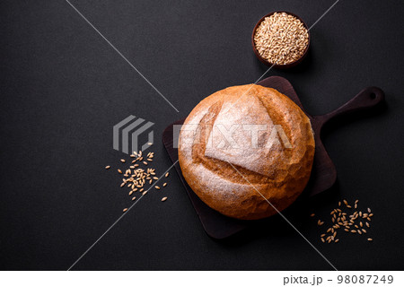 Beautiful delicious freshly baked round shaped white bread Beautiful delicious freshly baked round shaped white bread 98087249