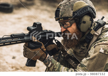 Sniper with rifle on a position Sniper with rifle on a position 98087332