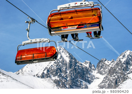 Ski lift and peak Lomnicky stit in High Tatras mountains in resort Tatranska Lomnica, Slovakia Ski lift and peak Lomnicky stit in High Tatras mountains in resort Tatranska Lomnica, Slovakia 98090420