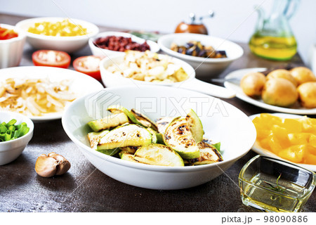 Hot stir fried vegetables on plates 98090886
