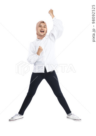 Asian Muslim woman in a headscarf with an excited expression 98092525